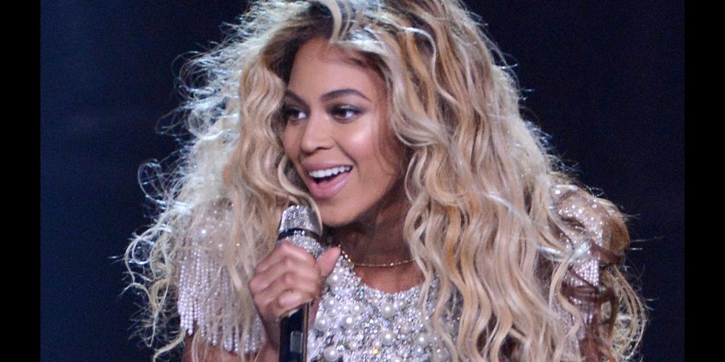 Beyonce singing and smiling