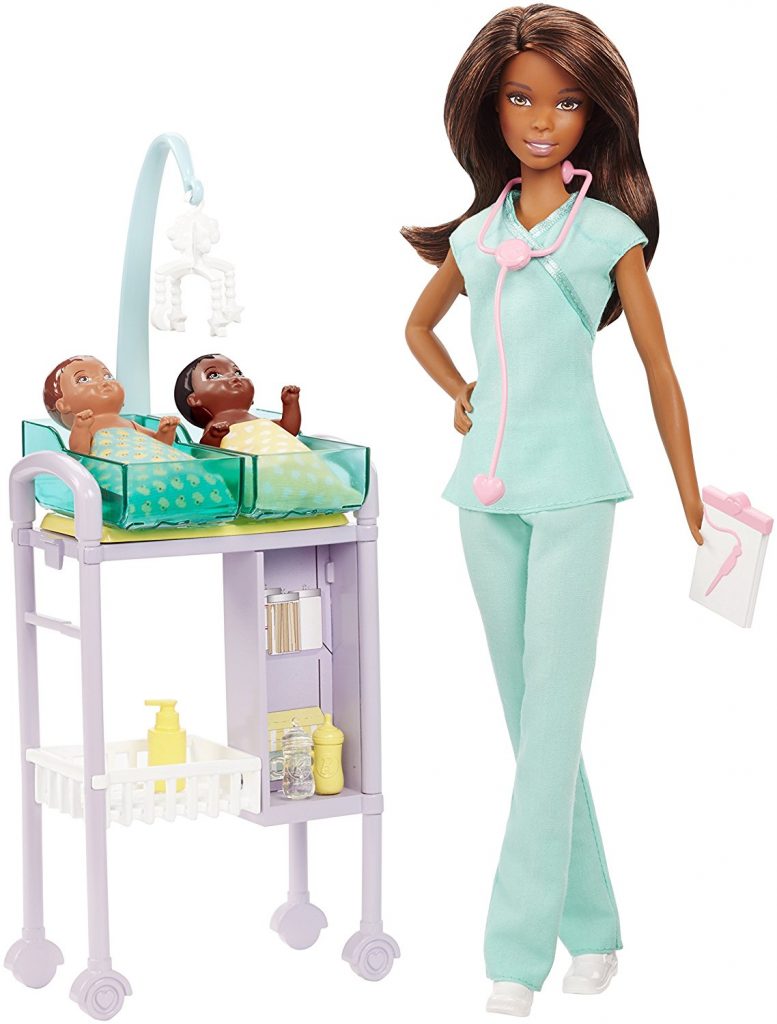 Doll in medical scrubs with two new born babies
