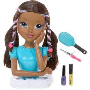 Styling head of black girl with braids and hair accessories