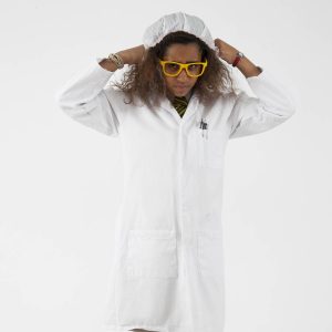 Young girl scientist tucking her hair into a hat