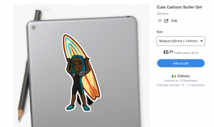 Sticker of a surfer girl stuck to a laptop