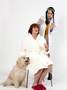 A woman and her granddaughter work on a science experiment.