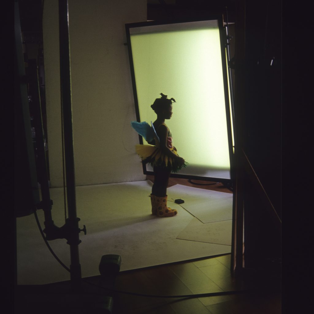 Little girls in fairy costume in a photographer's studio.