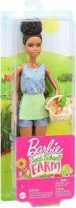 Barbie with afro puff and wicker basket in packaging