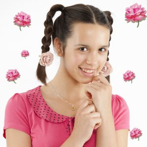Pretty girl with sweet smile and rose hair clips.